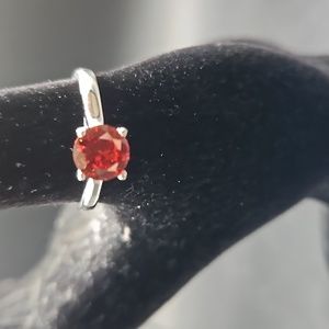 F-1 Silvertone ring with red solitaire